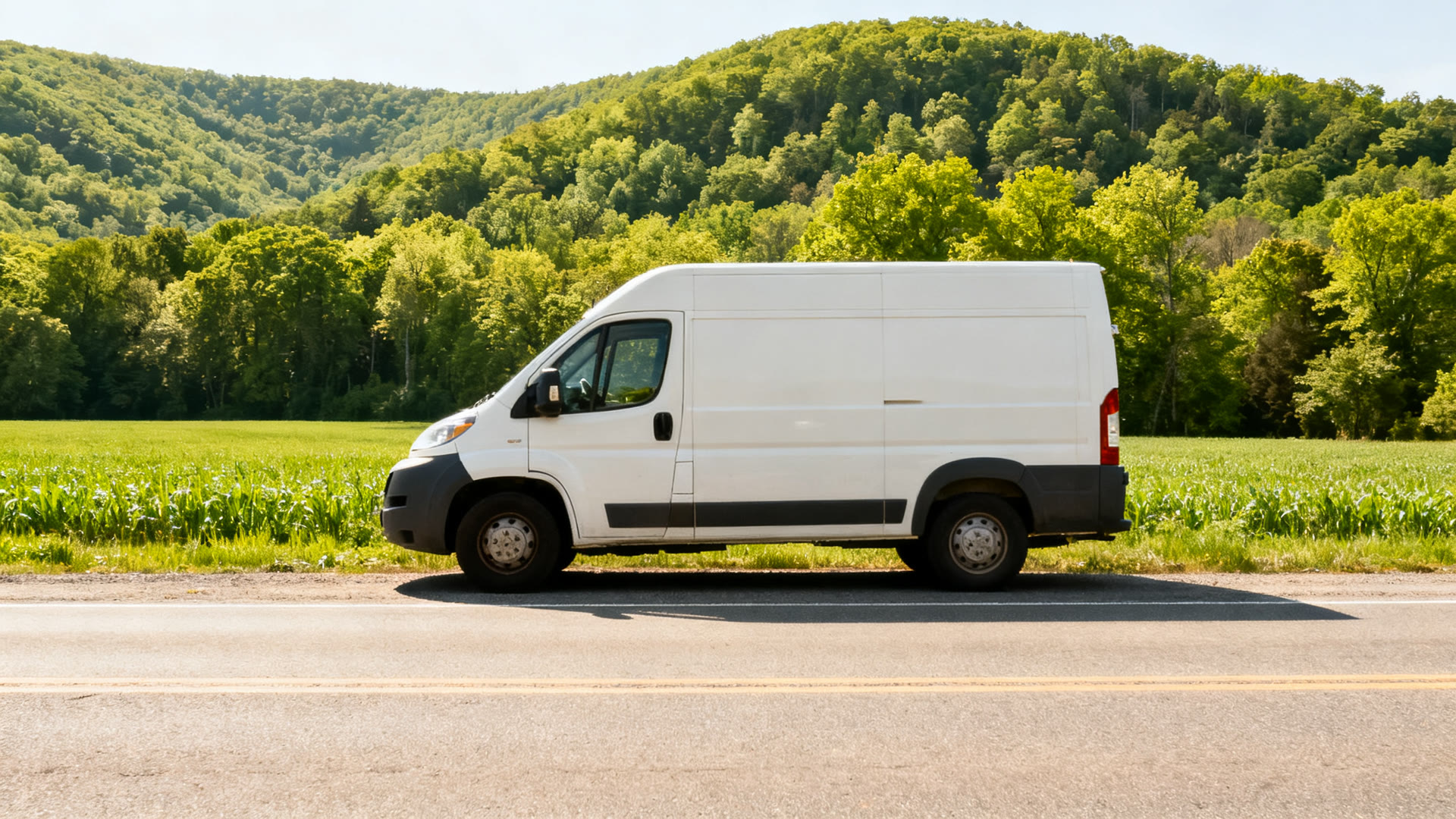 A work van parked on a quiet rural Pennsylvania road on a clear summer day